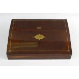 A Victorian rosewood lapdesk or writing slope with brass inlaid hinged cover, opening to reveal a