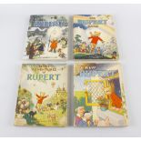 A group of four Daily Express Rupert the Bear children's books, comprising a 1946 'The New Rupert