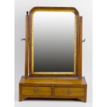 A 19th century swing dressing table mirror. The rectangular bevelled plate within wooden frame