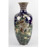 A good large Japanese Meiji period cloisonne vase. Of ovoid form with tall flared neck, decorated