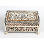 An Indian Vizagapatam miniature casket. The hinged cover having pieced plaque with central