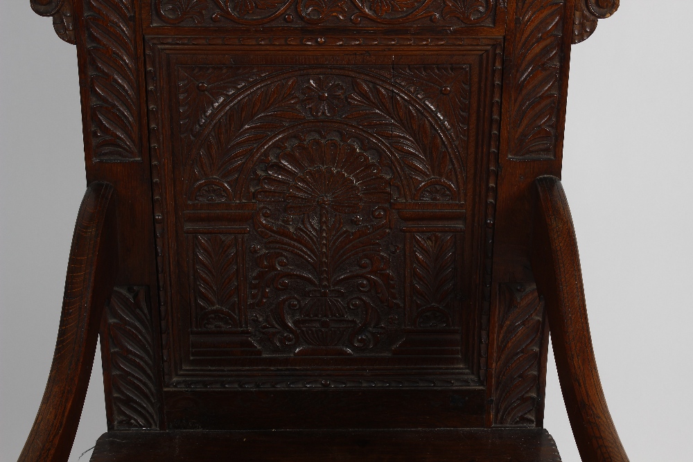An early 20th century carved oak Wainscot-style chair. The foliate scrolling crest above carved back - Image 3 of 3