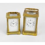 Two brass carriage clocks. The first having a white enamelled dial with Roman hours and Arabic