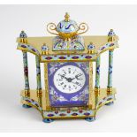 A modern Chinese enamel and brass mantel clock. The 2.5-inch dial having Roman hours and Arabic