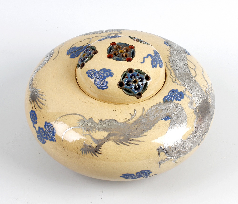 A Japanese Meiji period pottery koro, raised upon three small conical feet, with domed pierced