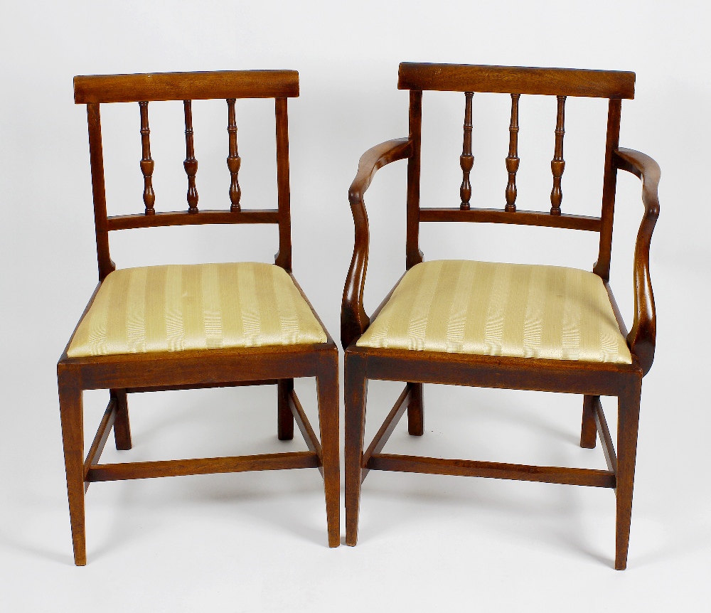 A set of four dinning chairs to include one carver, each having rail back and yellow upholstered