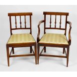 A set of four dinning chairs to include one carver, each having rail back and yellow upholstered