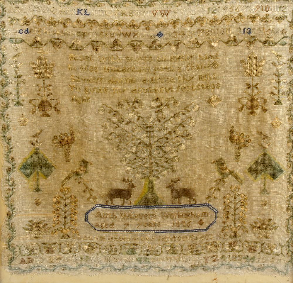 A framed Victorian sampler. Having single verse above central tree and deer, by 'Ruth Weavers