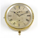 An early 20th century brass cased ships bulkhead style wall clock. The circular silvered dial with