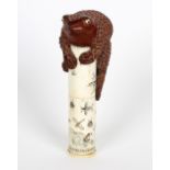 A Japanese bone scroll holder. Of cylindrical form having incised decoration depicting insects and