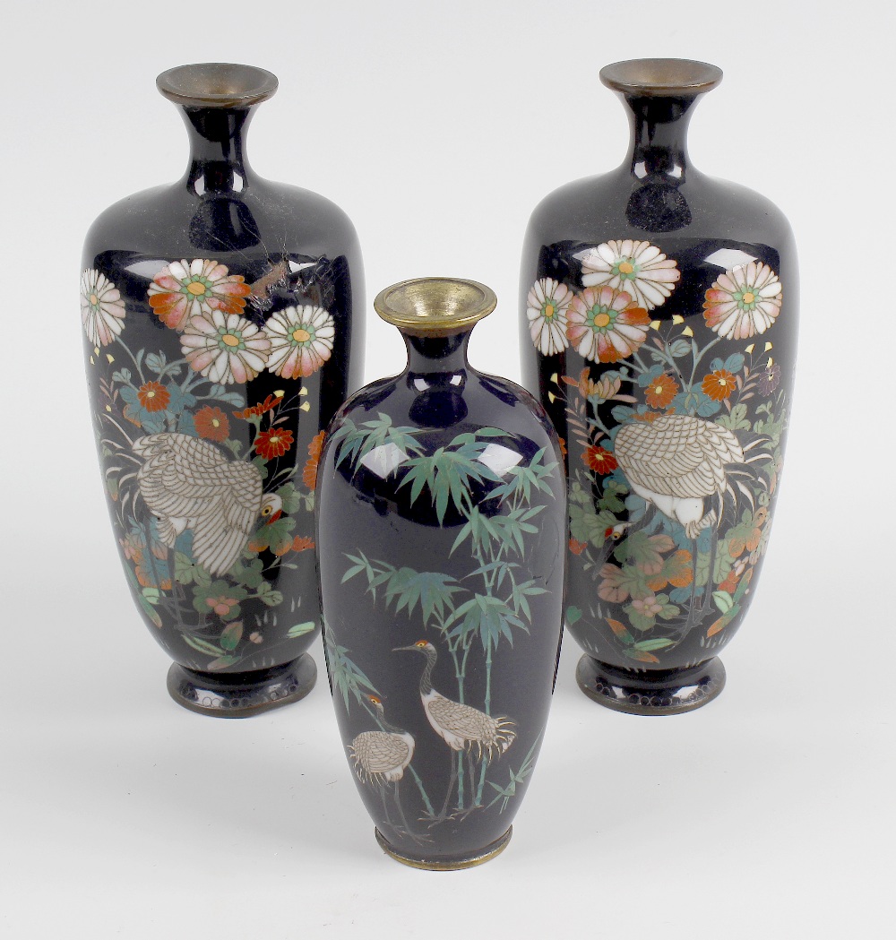 A small matched pair of Japanese Meiji period cloisonne vases, the ovoid shaped bodies with a blue