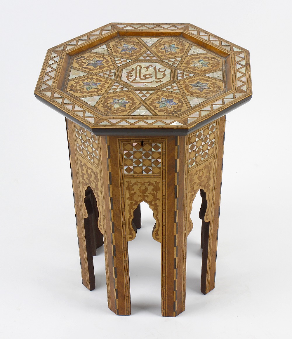 An early 20th century Eastern-style octagonal occasional or sewing table, the hinged mother-of-pearl