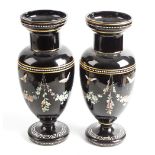 A pair of late 19th century enamelled black glass vases. Each of ovoid form and Stourbridge (Webb)