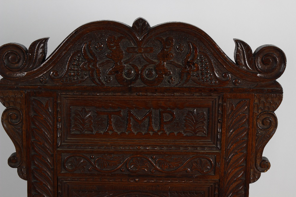 An early 20th century carved oak Wainscot-style chair. The foliate scrolling crest above carved back - Image 2 of 3