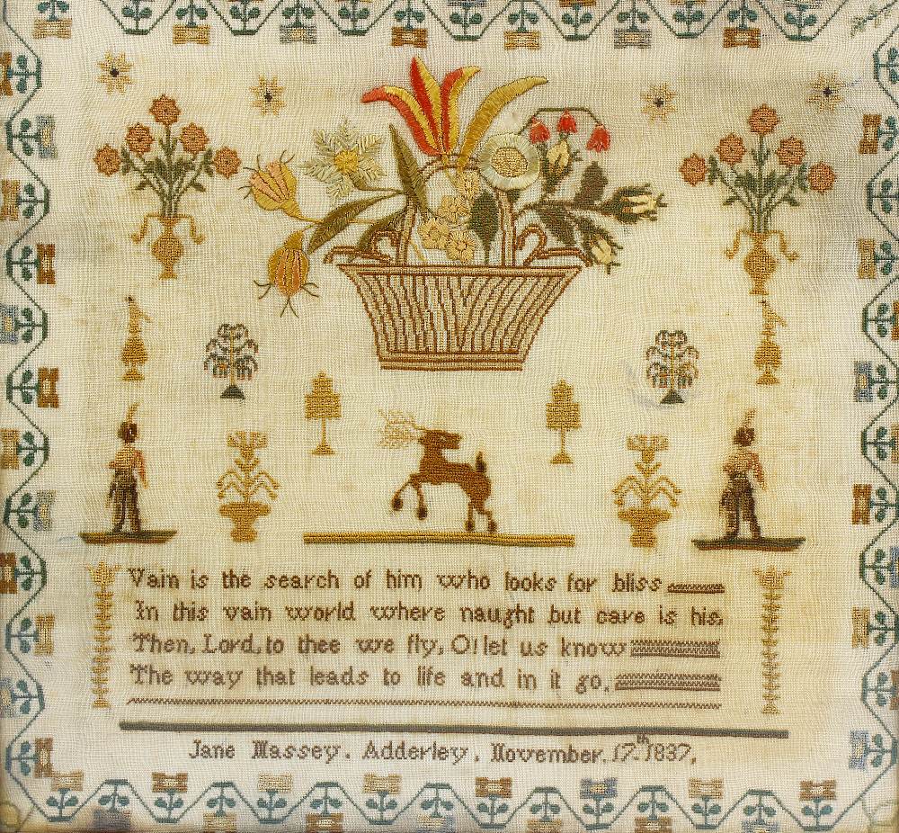 Two 19th century framed needlework samplers. The first depicting basket of flowers above single