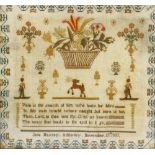 Two 19th century framed needlework samplers. The first depicting basket of flowers above single