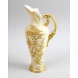 A Royal Worcester blush ivory ewer. Of slender tapering form having pierced shaped spout leading