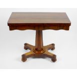 An early Victorian rosewood fold-over pedestal card table. The rounded oblong top enclosing a