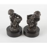 A pair of 19th century French bronzed figures modelled as putti, one with lamb and the other with