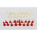 An early to mid-19th century complete carved ivory chess set, of red-stained and natural colour, the