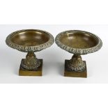 A pair of Regency bronze pedestal dishes. Each having formal acanthus leaf and foliate decoration to