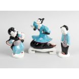 A rare group of three Royal Worcester Chinese figures, comprising a kneeling female number 3397,