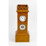 A late 19th century oak cased combination desk clock and barometer, with white enamelled circular