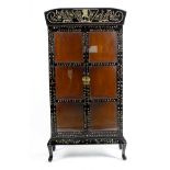 An unusual oriental black lacquered and mother-of-pearl inlaid folding desk, the hinged fall panel