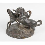 A 19th century bronze figure group. Modelled as two running horses upon a naturalistic ground, 5.