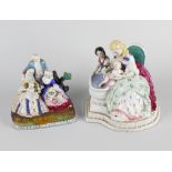 Two German porcelain desk stands. The first modelled as a mother bathing small child with attendant,