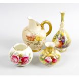 A group of four various Royal Worcester vases. Comprising one of pear form having tall fared neck