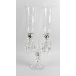 A Baccarat twin branch candelabra. The fluted socles each having pendant drops leading to the