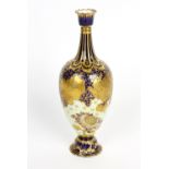 A Royal Crown Derby vase. Of pear form having tall fluted neck and raised upon short footed base,