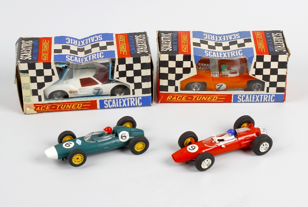 Four Scalextric model race cars. C11 Super Electra, C77 Ford GT, C81 Cooper and C85 BRM. Group