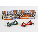 Four Scalextric model race cars. C11 Super Electra, C77 Ford GT, C81 Cooper and C85 BRM. Group