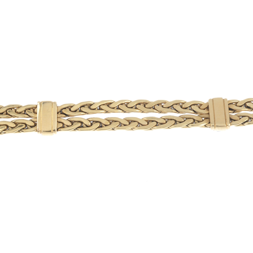 An 18ct gold diamond and gem-set bracelet. The looped rope-twist chain, with calibre-cut sapphire, - Image 5 of 5