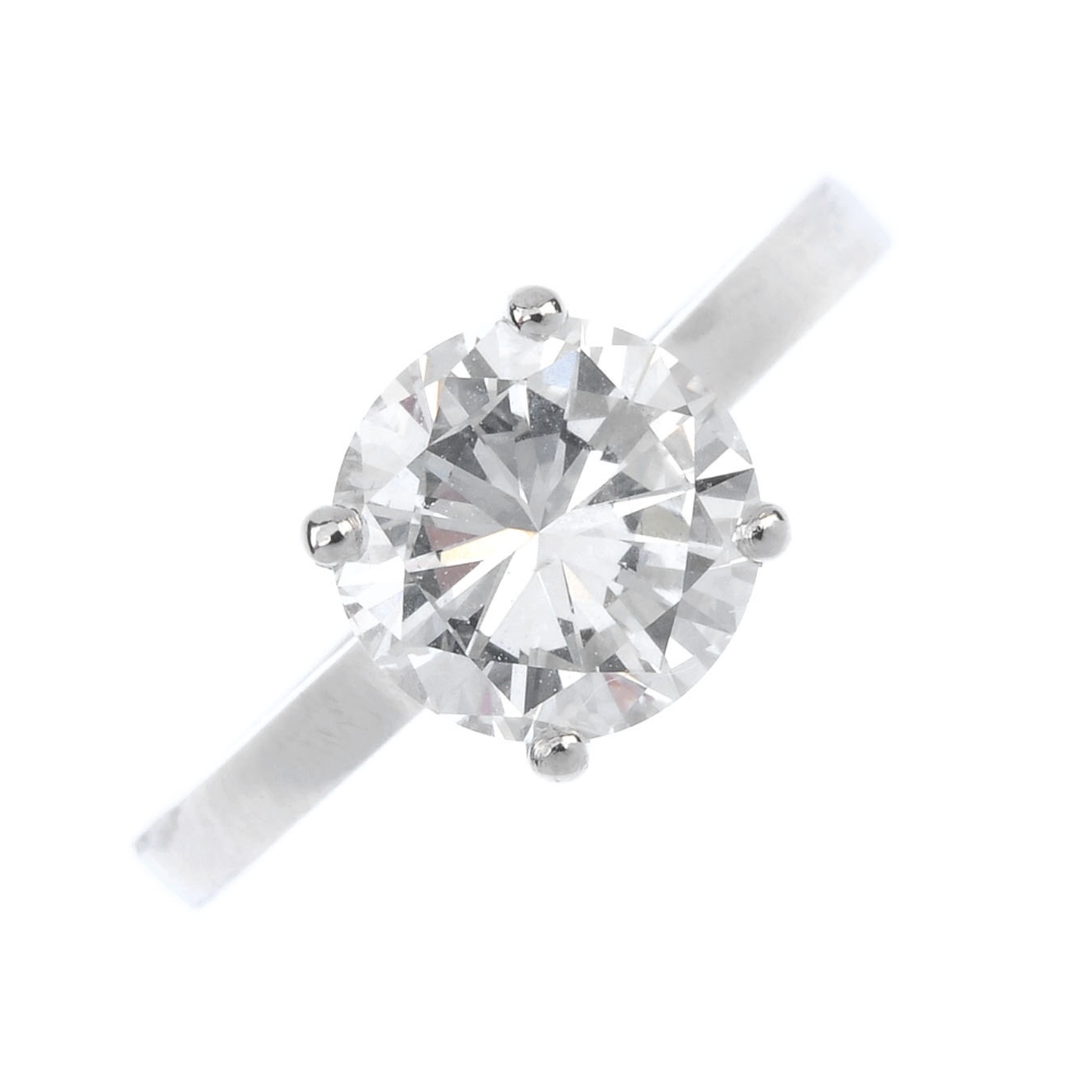 A platinum diamond single-stone ring. The brilliant-cut diamond, weighing 1.87cts, to the plain