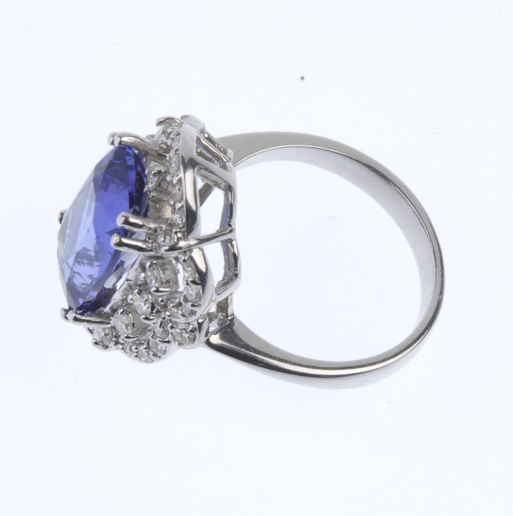 A tanzanite and diamond cluster ring. The oval-shape tanzanite, within a brilliant-cut diamond - Image 4 of 4