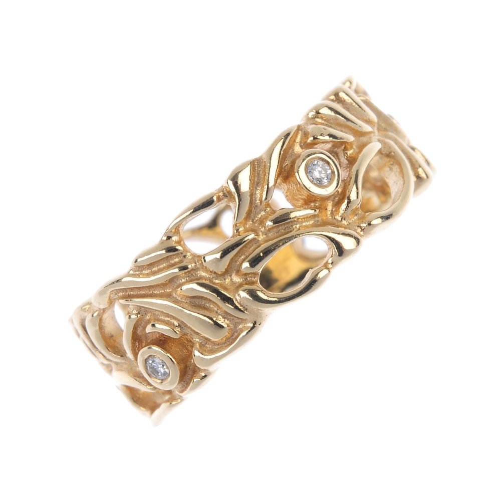PANDORA - a 14ct gold diamond band ring. Of openwork foliate design, with brilliant-cut diamond