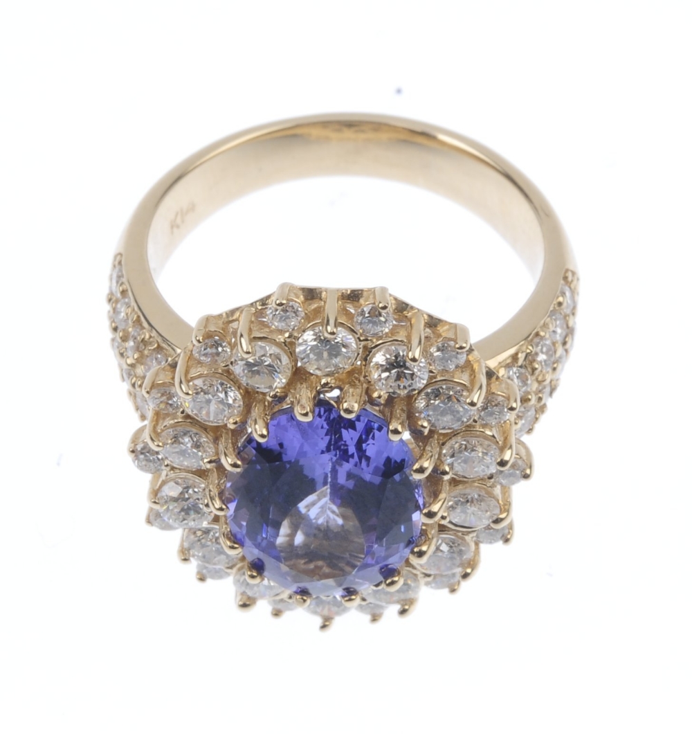 A tanzanite and diamond cluster ring. The oval-shape tanzanite, within a brilliant-cut diamond - Image 4 of 4