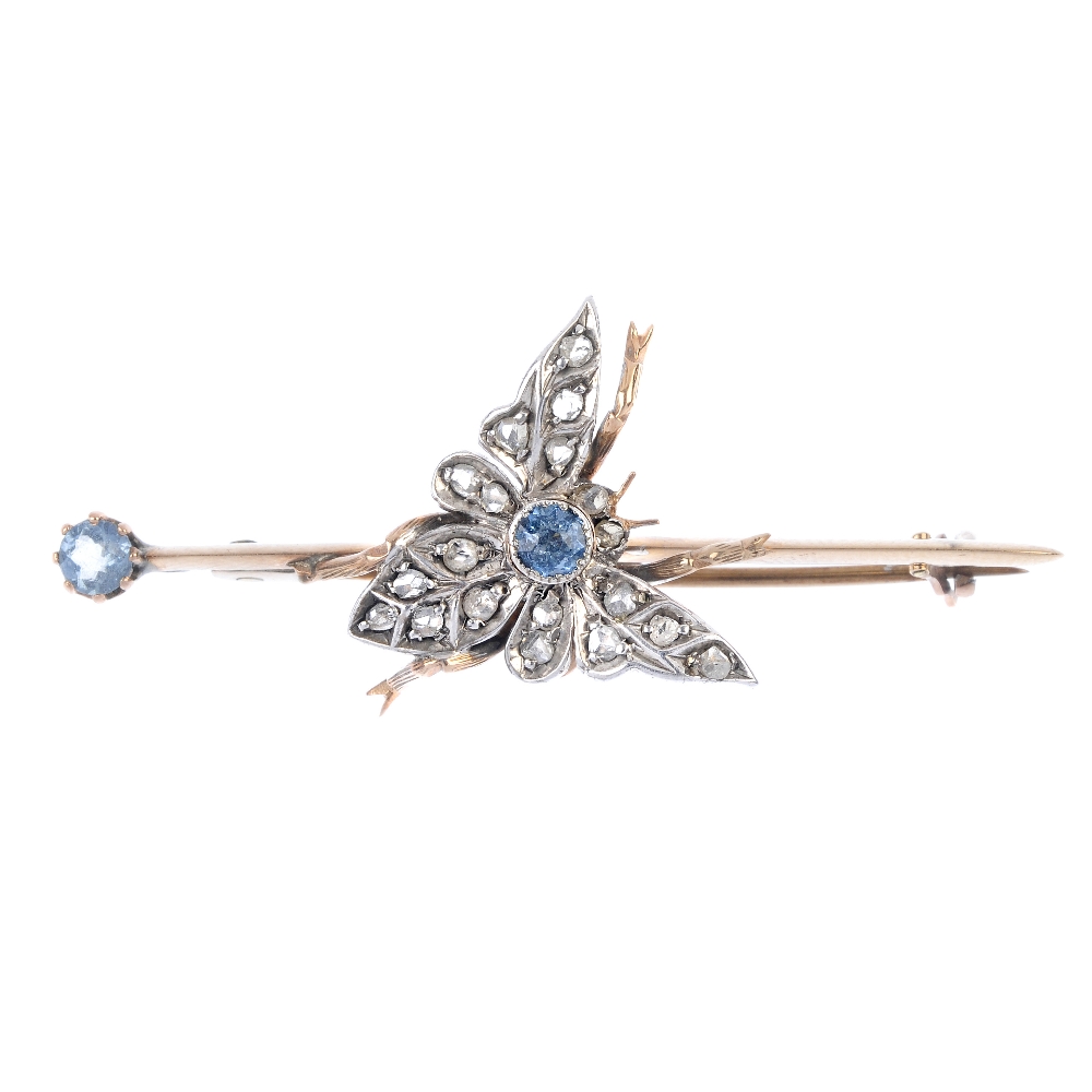 An aquamarine and diamond moth brooch. The rose-cut diamond moth, with circular-shape aquamarine
