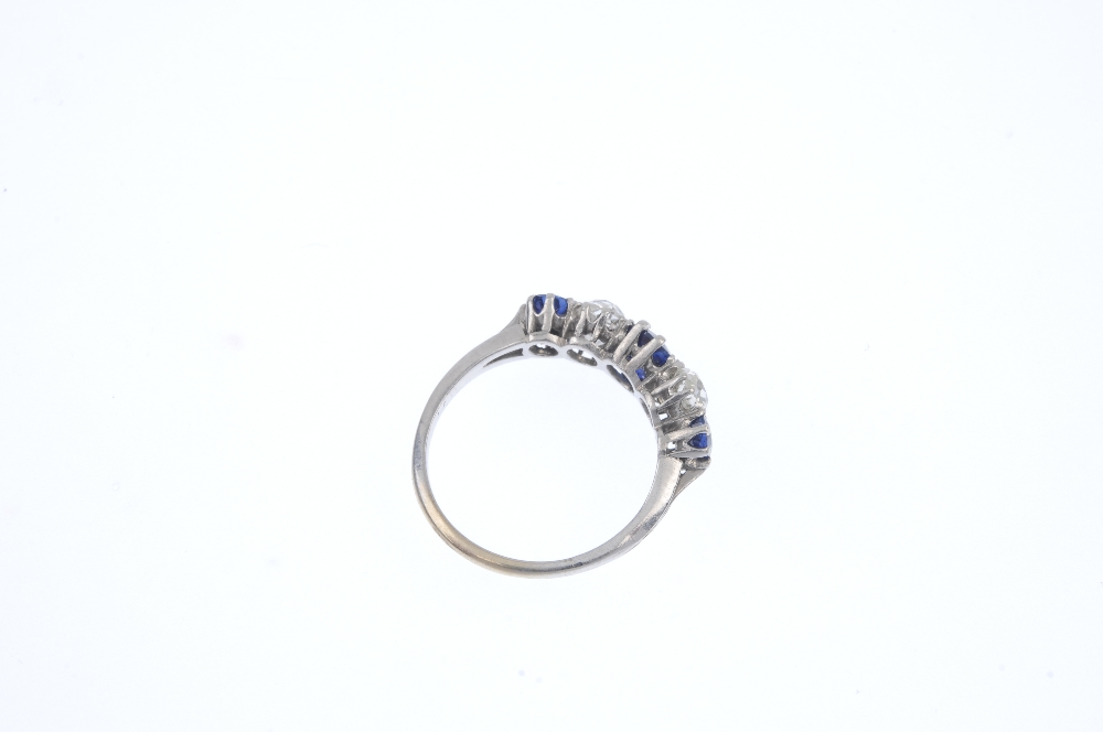 An early 20th century platinum and gold, sapphire and diamond ring. The alternating graduated oval- - Image 4 of 4