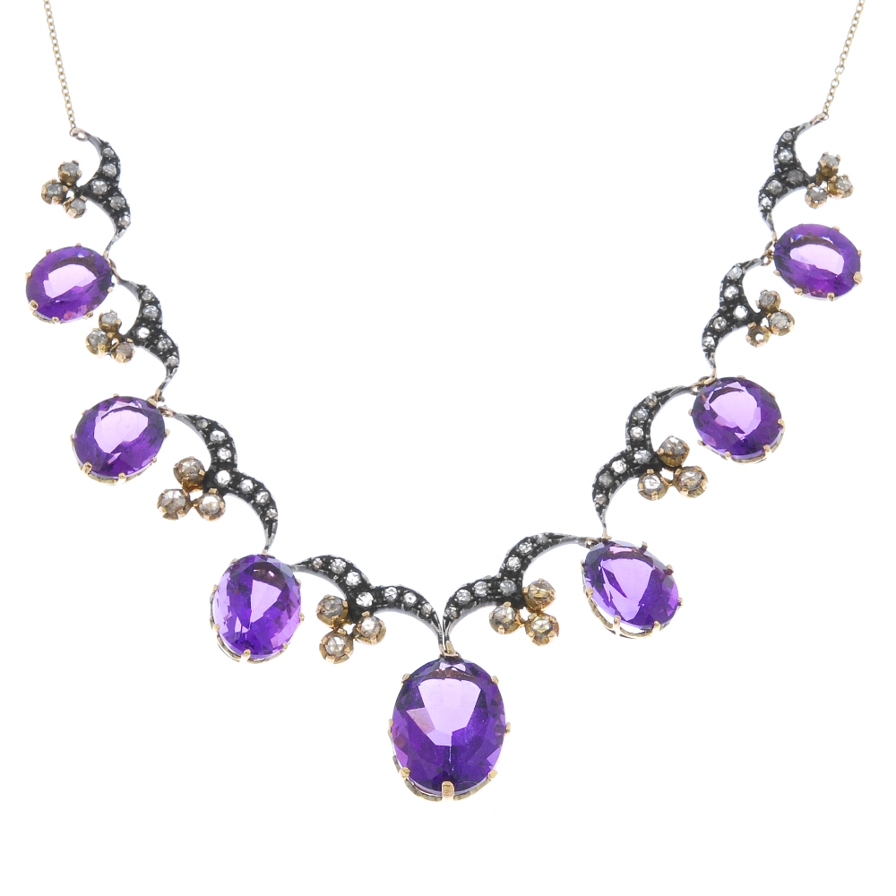 An amethyst and diamond necklace. The graduated oval-shape amethyst fringe, with similarly graduated