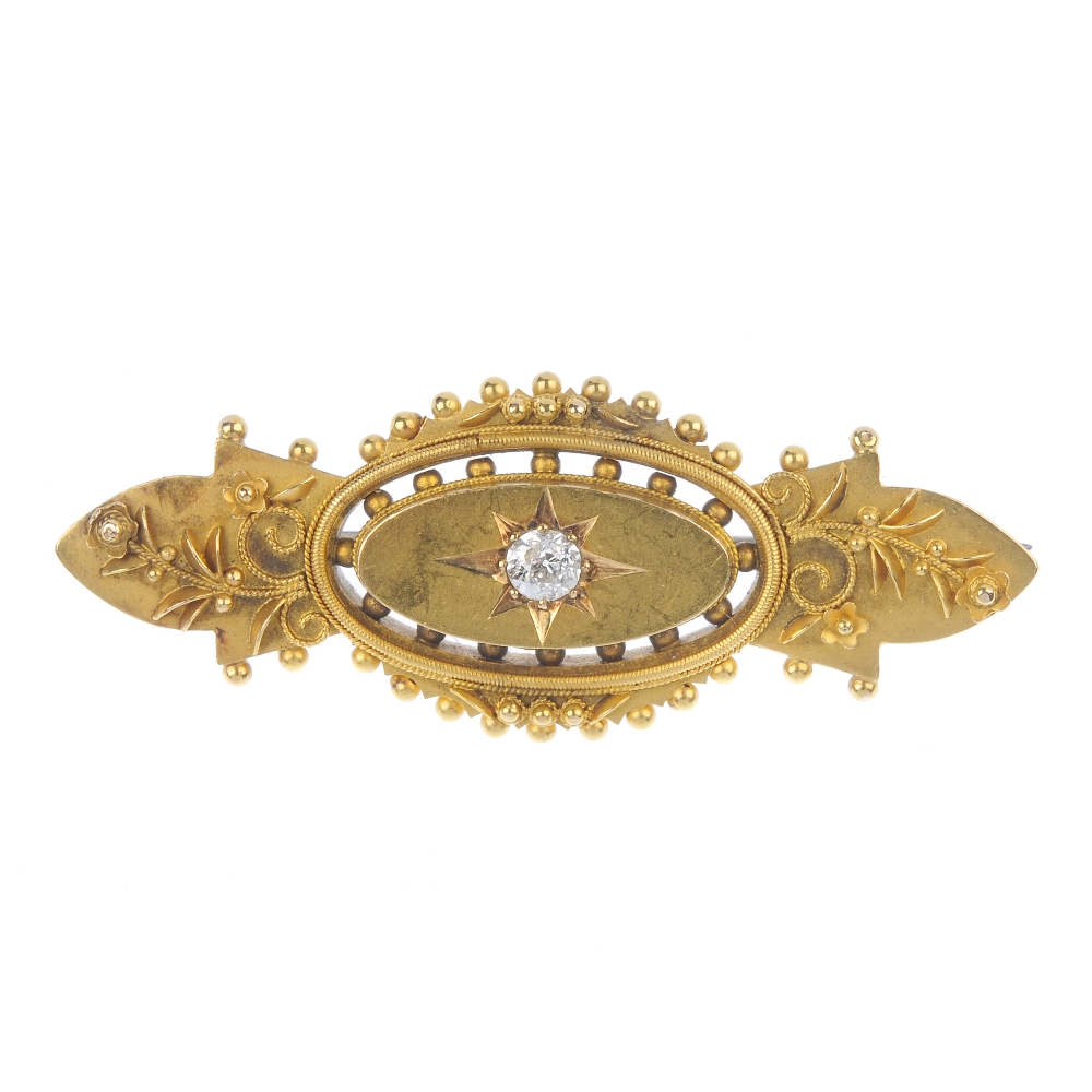 An early 20th century 15ct gold diamond brooch. The old-cut diamond star, within an oval-shape