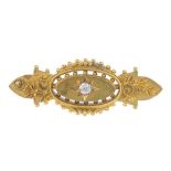 An early 20th century 15ct gold diamond brooch. The old-cut diamond star, within an oval-shape
