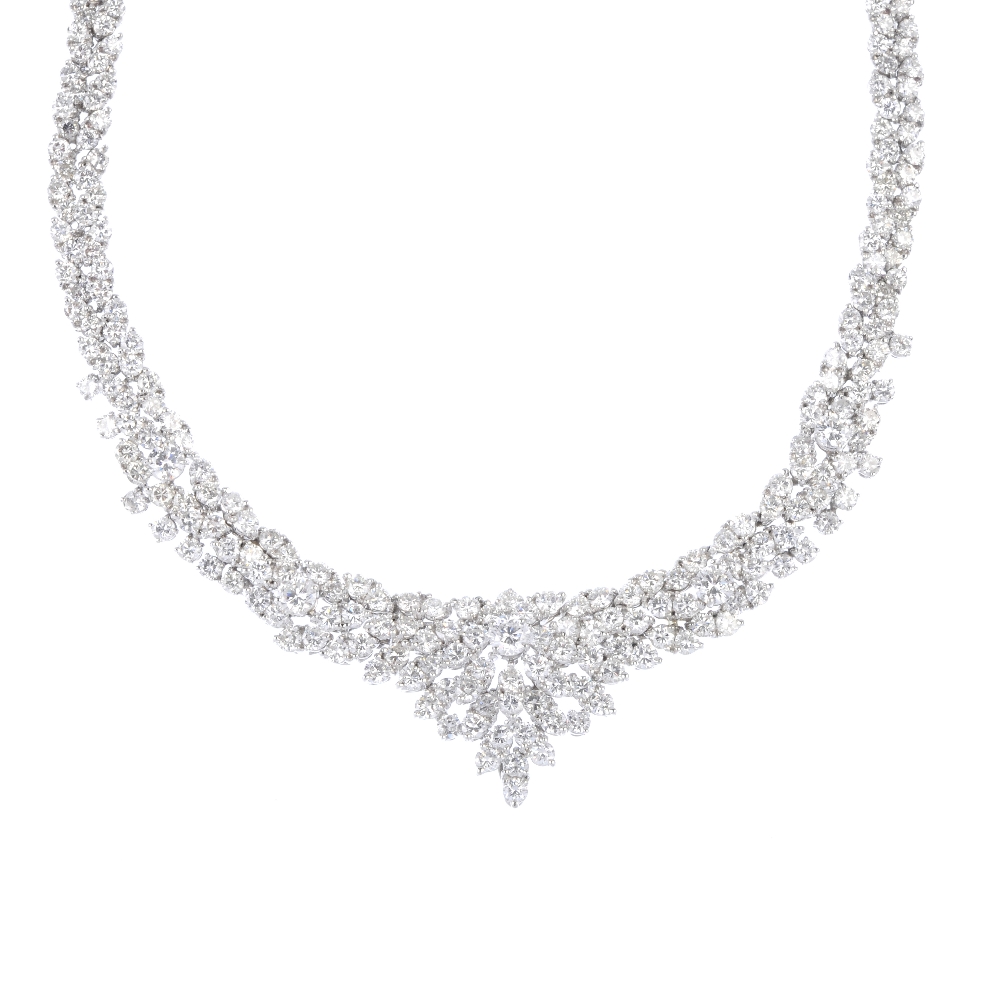 A diamond articulated collar. Comprising a series of five brilliant-cut diamonds, raised within