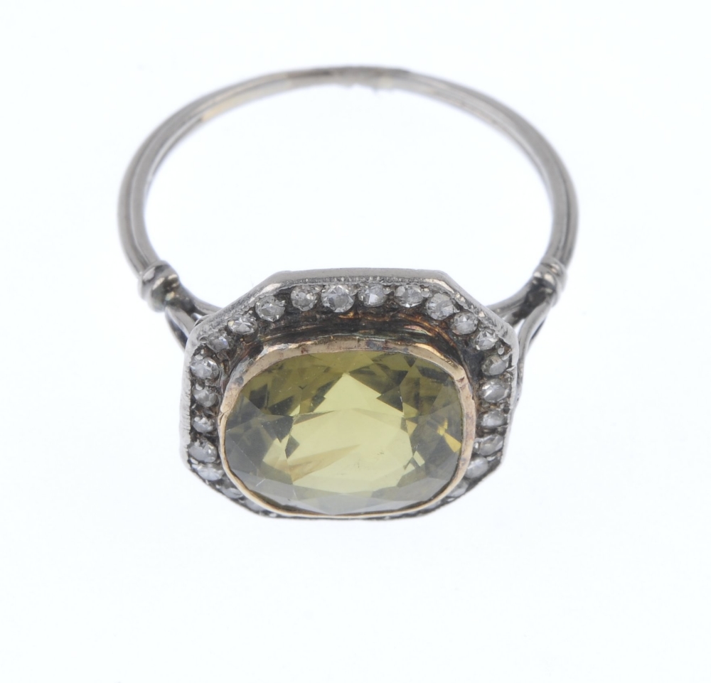 A mid 20th century chrysoberyl and diamond cluster ring. The cushion-shape yellowish green - Image 2 of 4