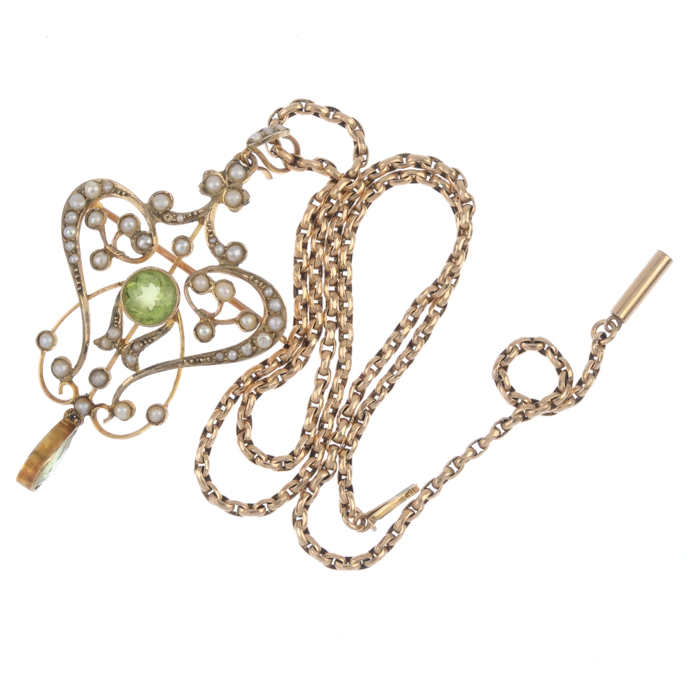 An early 20th century 15ct gold peridot and split pearl pendant. The circular-shape peridot, - Image 3 of 3