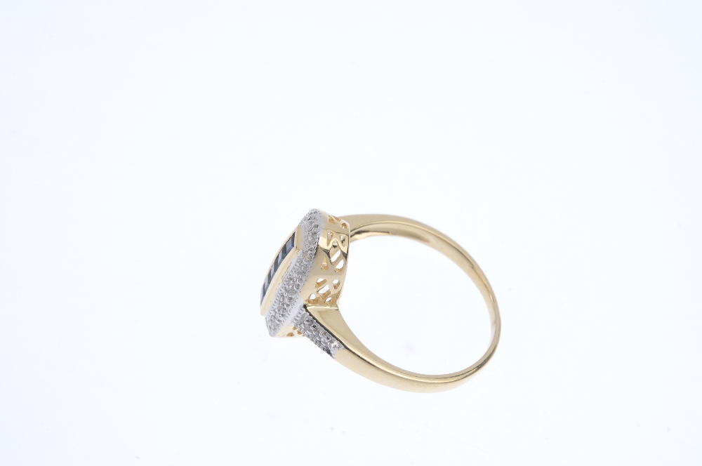 An 18ct gold sapphire and diamond ring. The square-shape sapphire line, within a channel setting, to - Image 3 of 4