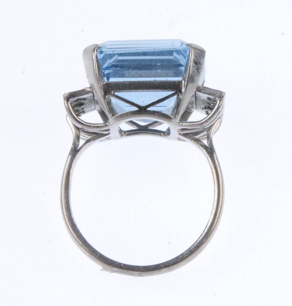 An aquamarine and diamond dress ring. The square-shape aquamarine, to the brilliant-cut diamond line - Image 2 of 3